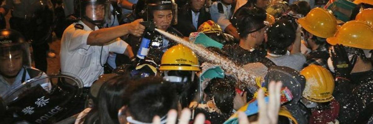 New Clashes in Hong Kong as Pro-Democracy Activists Surround Govt Buildings