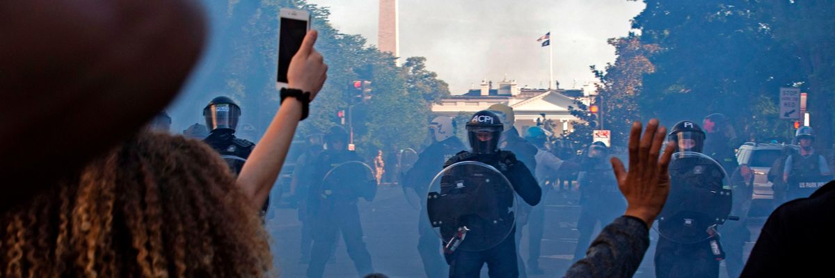 Police officers wearing riot gear push back demonstrators outside of the White House on June 1, 2020 in Washington D.C.