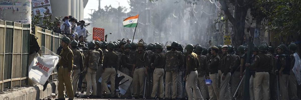 Police personnel and protestors seen during anti-Muslim attacks at Jaffrabad on February 24, 2020 in New Delhi, India