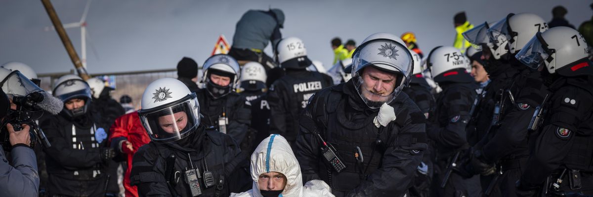 Police remove an activist on January 11, 2023 in Lützerath near Erkelenz, Germany.