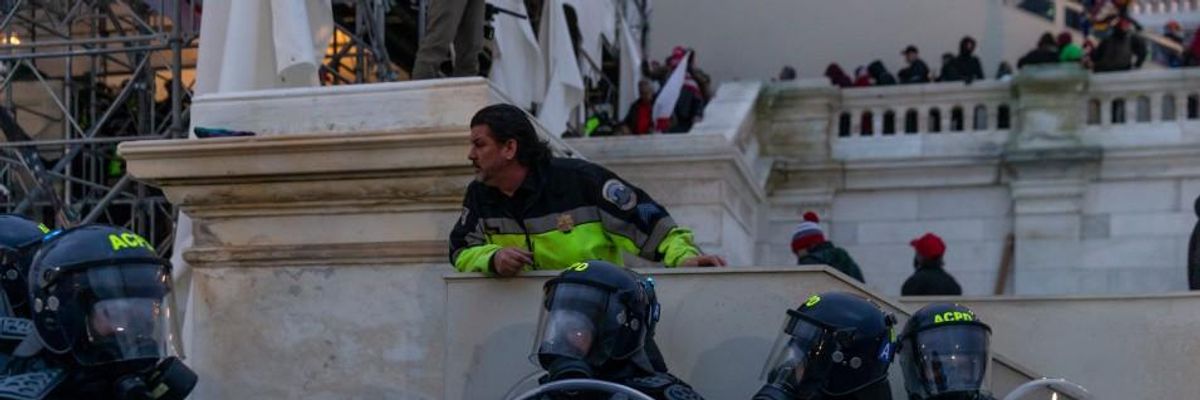 Police seen around Capitol building where pro-Trump supporters riot and breached the Capitol on January 6, 2021