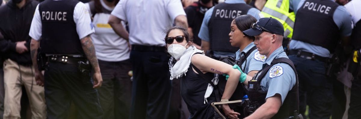 Police take demonstrators into custody on the campus of the Art Institute of Chicago