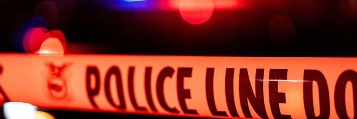 Police tape blocks off the crime scene