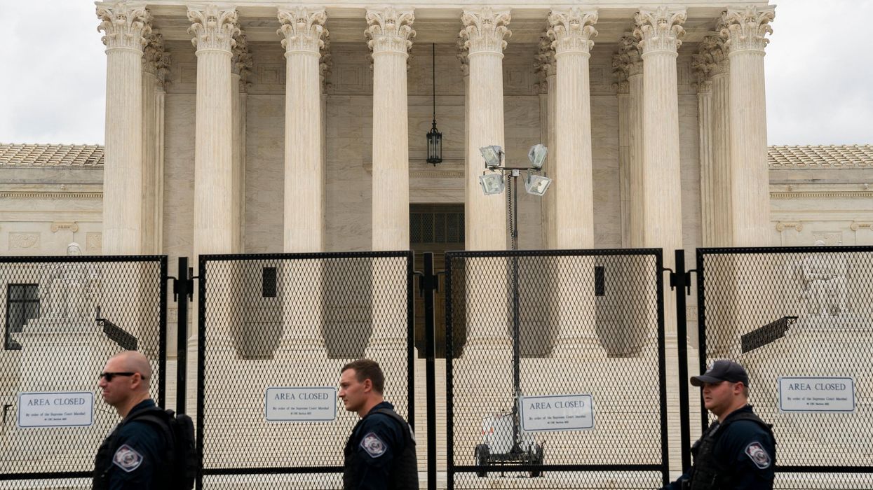 Police walk in front of the U.S. Supreme Court in Washington, D.C., on June 27, 2022