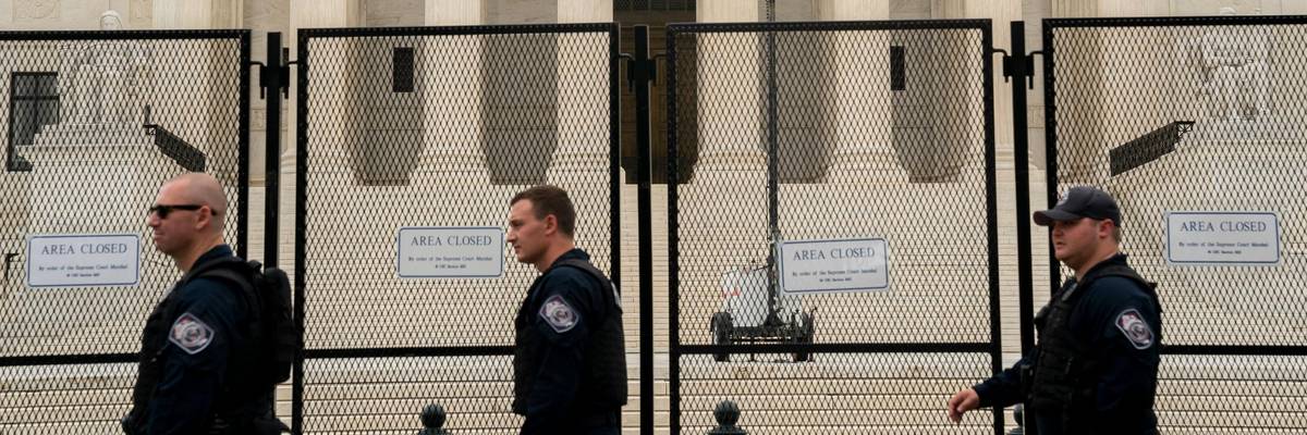 Police walk in front of the US Supreme Court in Washington, DC, on June 27, 2022