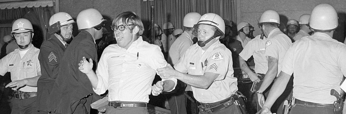 Policeman Hustles Screaming Demonstrator
