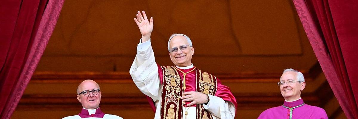 Pope Leo waves to crowd.