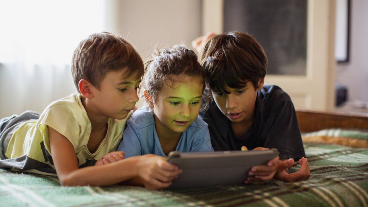 Portrait of boys using a digital tablet