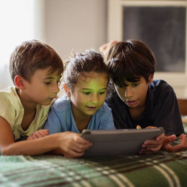 Portrait of boys using a digital tablet