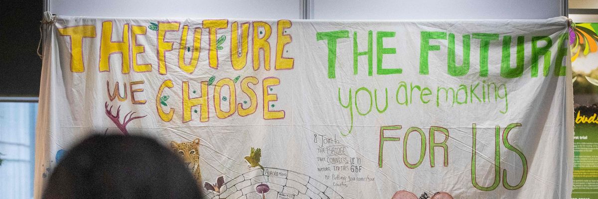 Poster reads: "The Future We Choose" vs "The Future You Are Making for Us"