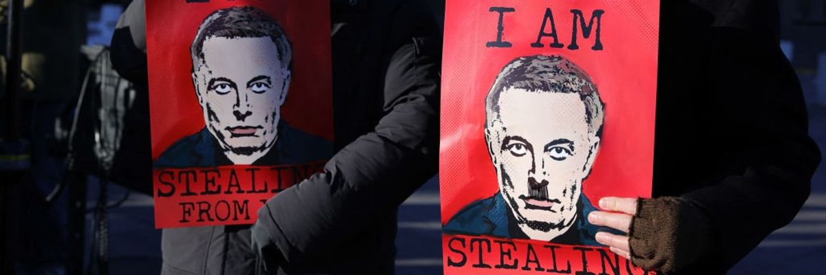 Posters of Elon Musk that say "I am stealing from you."