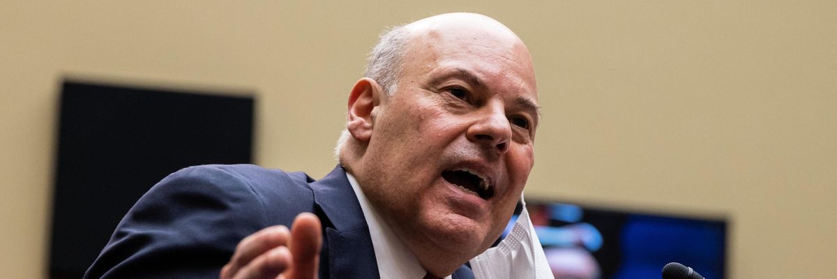 Postmaster General Louis DeJoy speaks at a hearing