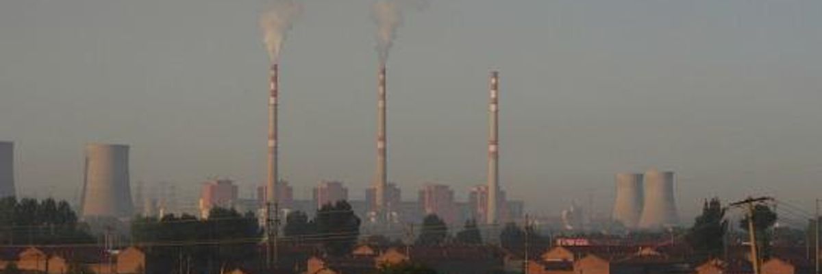 China Makes Landmark Pledge to Cap Emissions