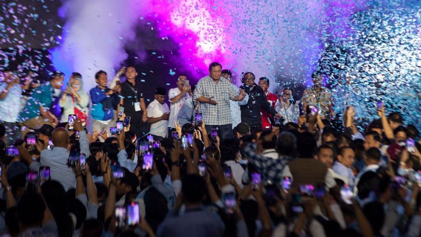 Prabowo Subianto celebrates with supporters amid a shower of confetti 