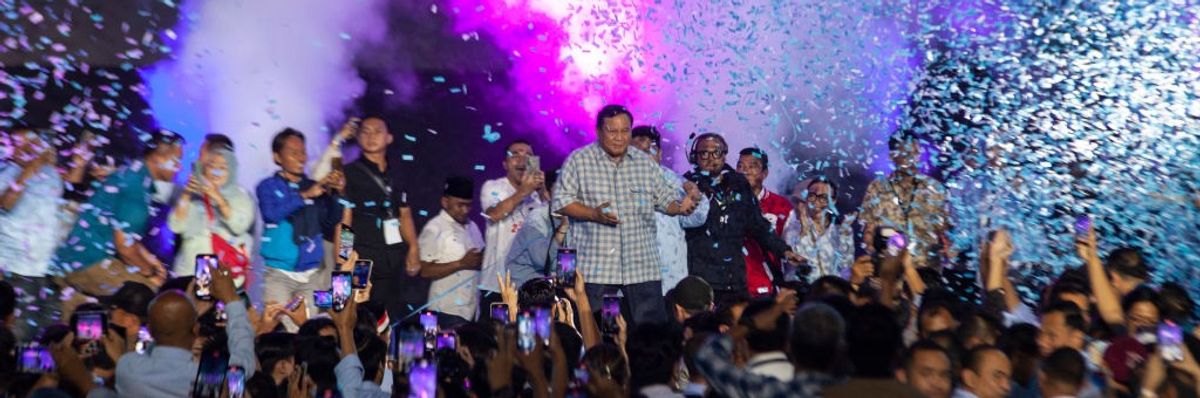 Prabowo Subianto celebrates with supporters amid a shower of confetti