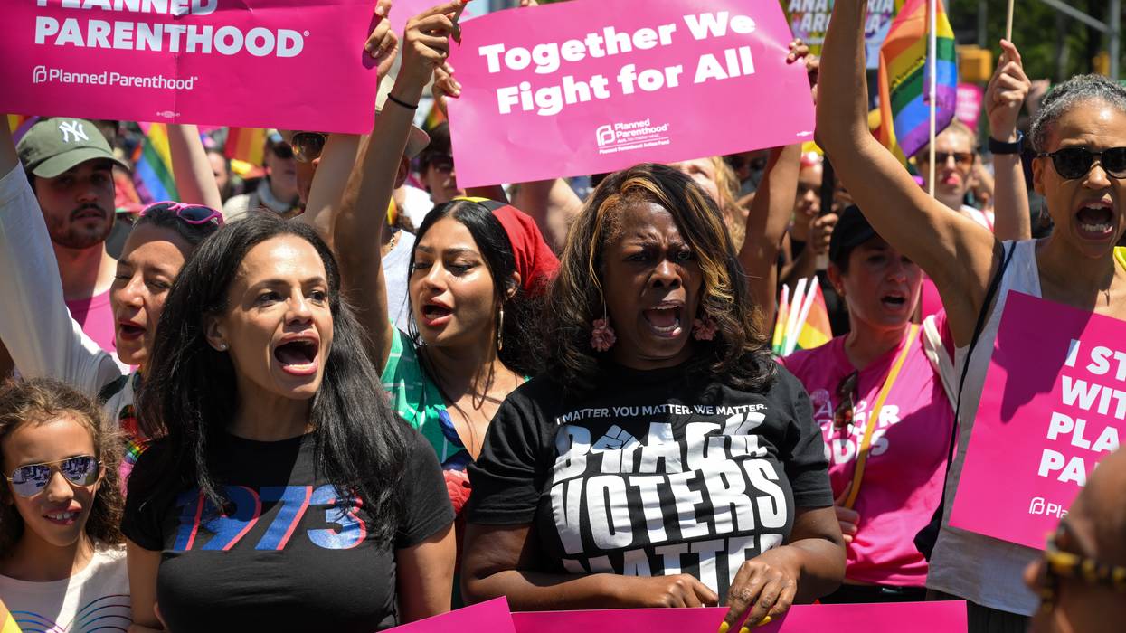President and CEO of Planned Parenthood Alexis McGill Johnson (L) marches with Planned Parenthood