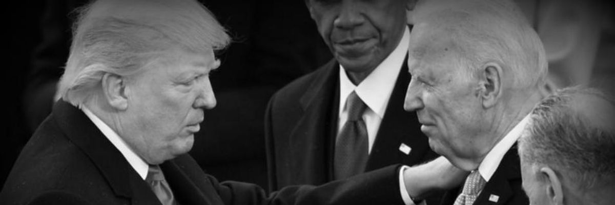 President Donald J. Trump shakes hands with Former vice president Joe Biden as Former president Barack Obama looks on at the inauguration of President Donald J. Trump on January 20, 2017