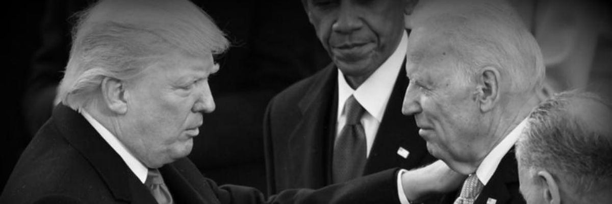 President Donald J. Trump shakes hands with Former vice president Joe Biden as Former president Barack Obama looks on at the inauguration of President Donald J. Trump on January 20, 2017