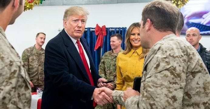 President Donald Trump and first lady Melania Trump greet members of the military during an unannounced trip to Al Asad Air Base in Iraq. (Photo: Saul Loeb/AFP/Getty Images)