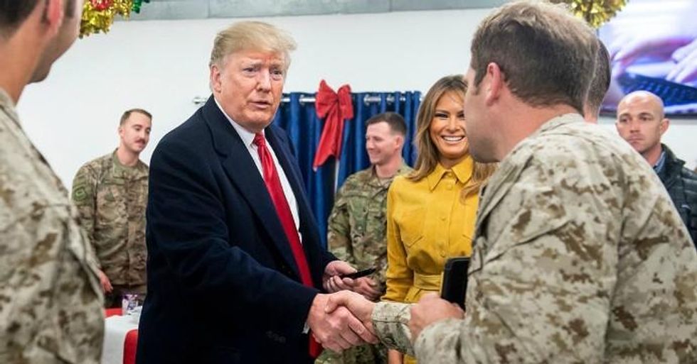 President Donald Trump and first lady Melania Trump greet members of the military during an unannounced trip to Al Asad Air Base in Iraq. (Photo: Saul Loeb/AFP/Getty Images)