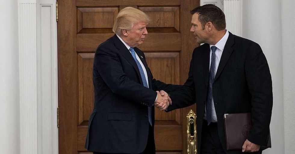 President Donald Trump and Kris Kobach, Kansas secretary of state, shake hands following their meeting with president-elect at Trump International Golf Club, November 20, 2016 in Bedminster Township, New Jersey. (Photo: Drew Angerer/Getty Images)