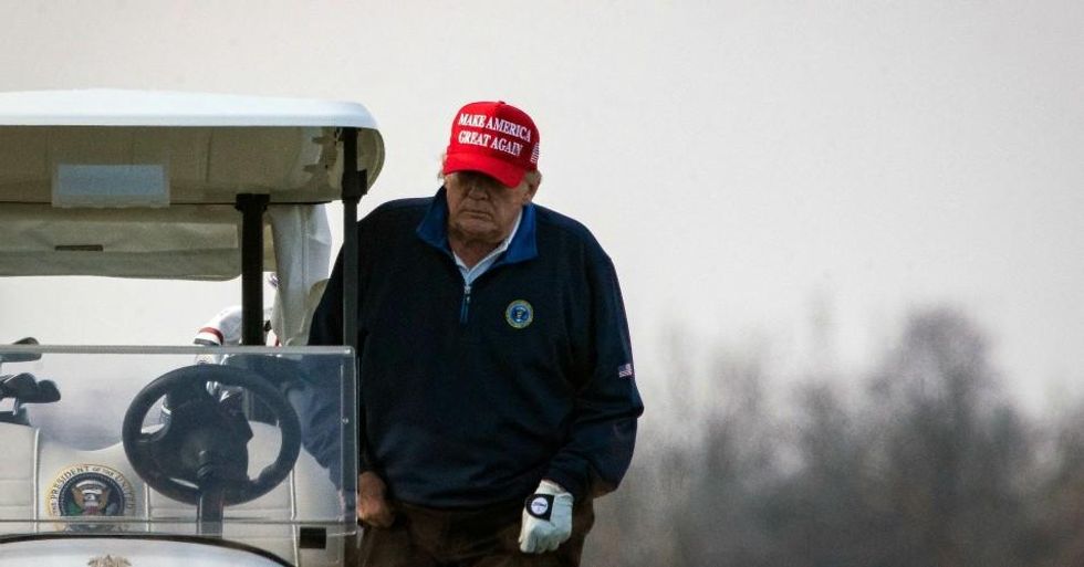 President Donald Trump climbs into golf cart number 45 as he golfs at Trump National Golf Club on December 13, 2020 in Sterling, Virginia. (Photo: Al Drago/Getty Images)