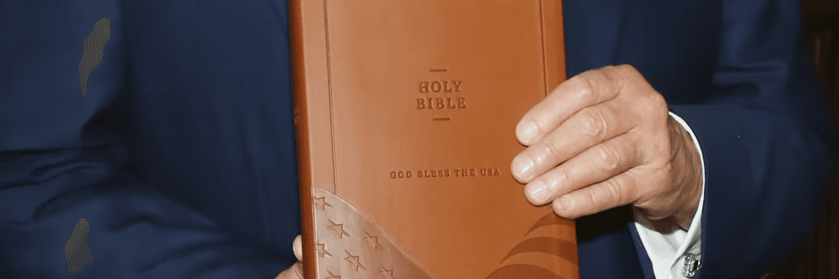 President Donald Trump holds a "Good Bless the USA Bible"