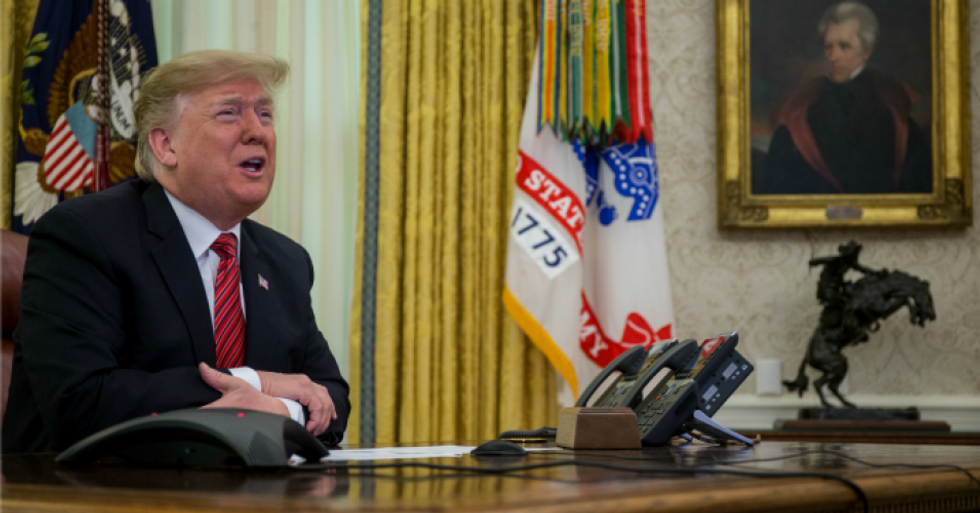 President Donald Trump makes a video call to service members from the Army, Marine Corps, Navy, Air Force, and Coast Guard stationed worldwide in the Oval Office at the White House December 25, 2018 in Washington, D.C. (Photo: Zach Gibson-Pool/Getty Images)