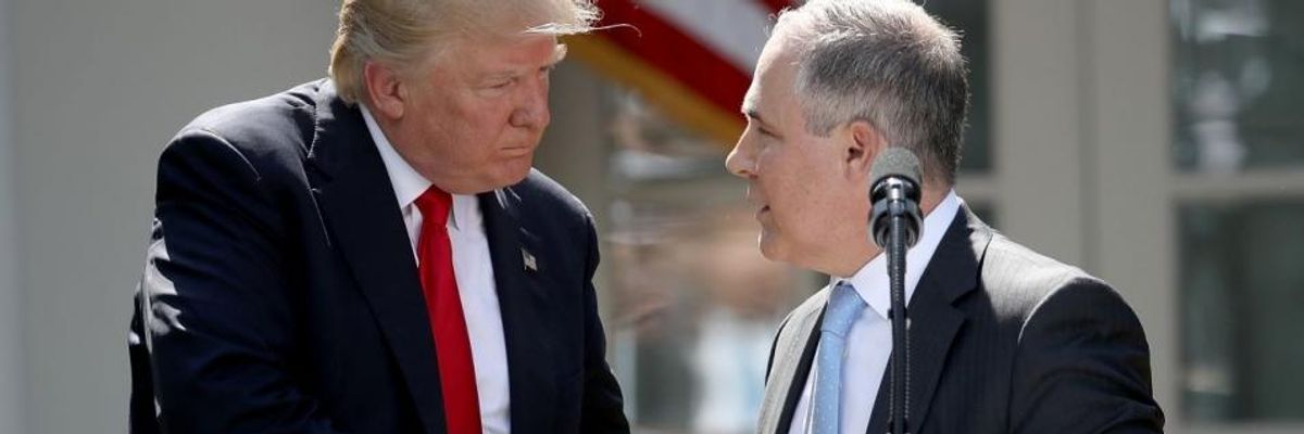 President Donald Trump shakes hands with EPA Administrator Scott Pruitt