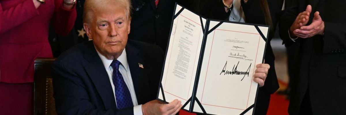 President Donald Trump signs the Laken Riley Act into law