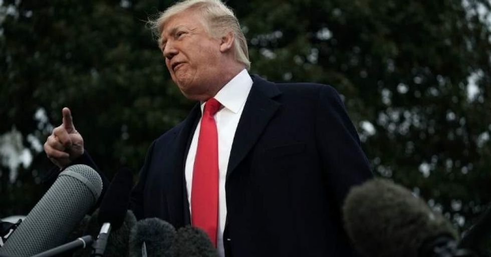 President Donald Trump speaks to members of the White House Press Corps prior to his Marine One departure from the South Lawn of the White House December 15, 2017 in Washington, D.C. (Photo: Alex Wong/Getty Images)