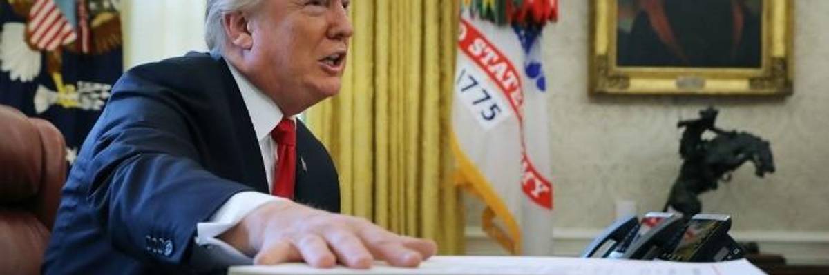 President Donald Trump talks with journalists before signing tax reform legislation into law in the Oval Office December 22, 2017 in Washington, DC. Trump praised Republican leaders in Congress for all their work on the biggest tax overhaul in decades. (Photo: Chip Somodevilla/Getty Images)