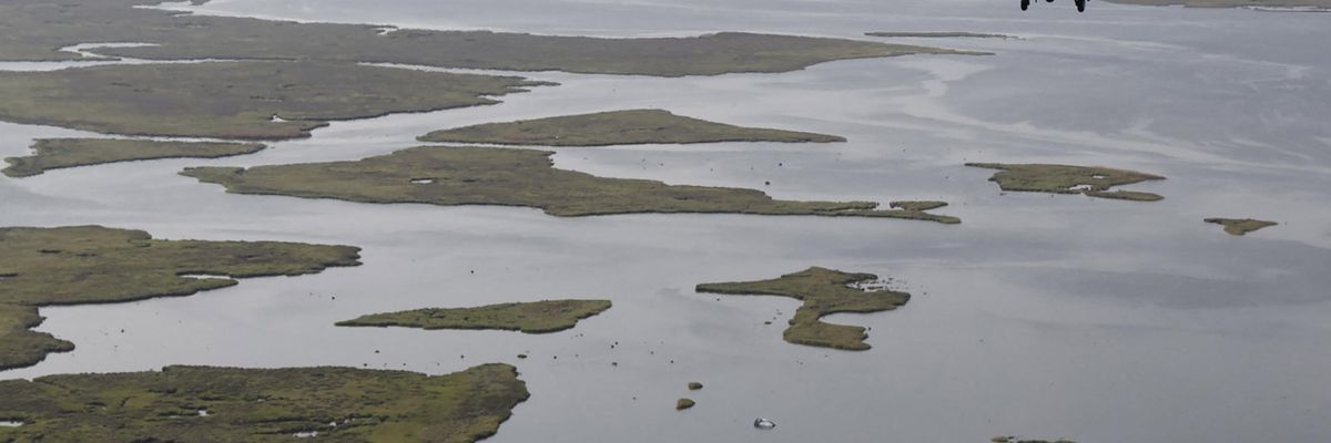 President Joe Biden, aboard the Marine One helicopter, inspects the damage from Hurricane Ida