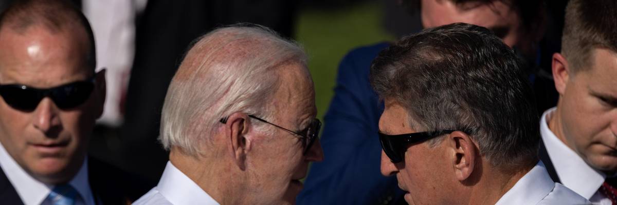 President Joe Biden and Sen. Joe Manchin speak at a White House event