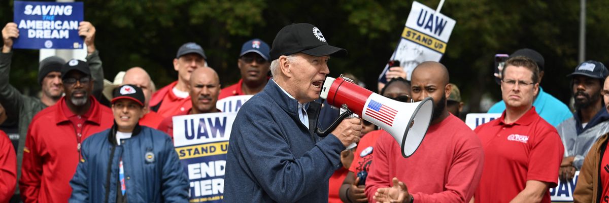 President Joe Biden and striking UAW workers