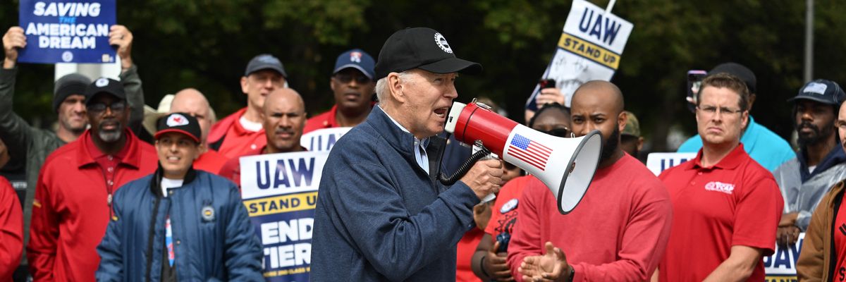 President Joe Biden and striking UAW workers