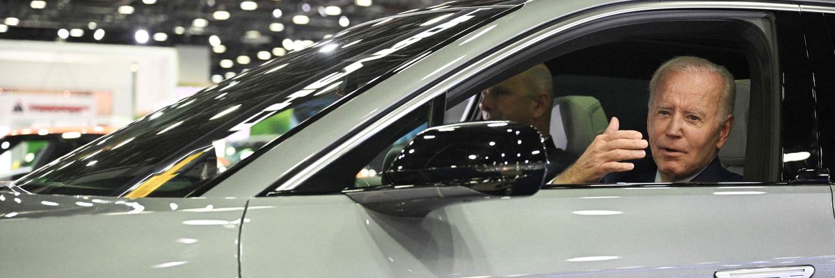 President Joe Biden in an electric vehicle