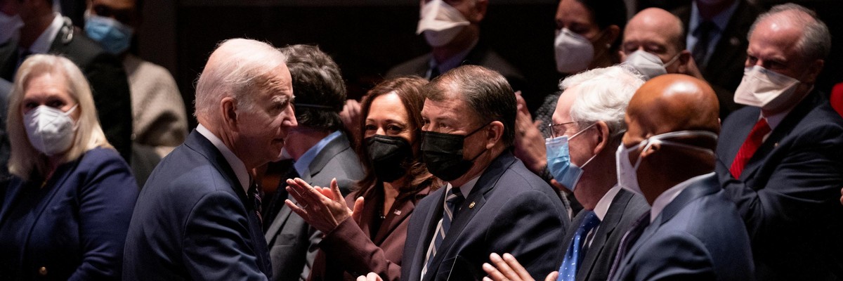 President Joe Biden shakes hands with Republican Senate Minority Leader Mitch McConnell