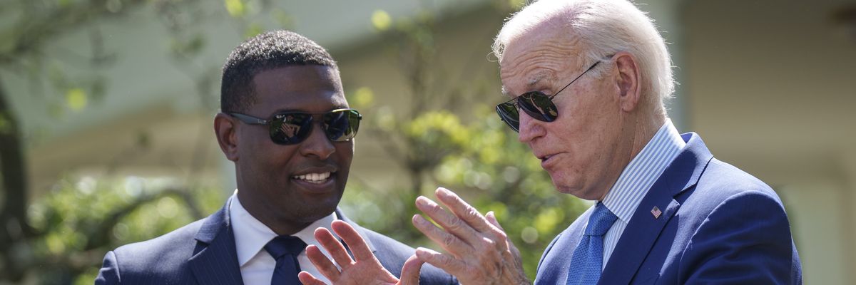 President Joe Biden talks to EPA Administrator Michael Regan