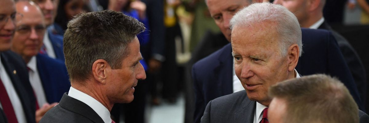 President Joe Biden talks with Lockheed Martin CEO Jim Taiclet