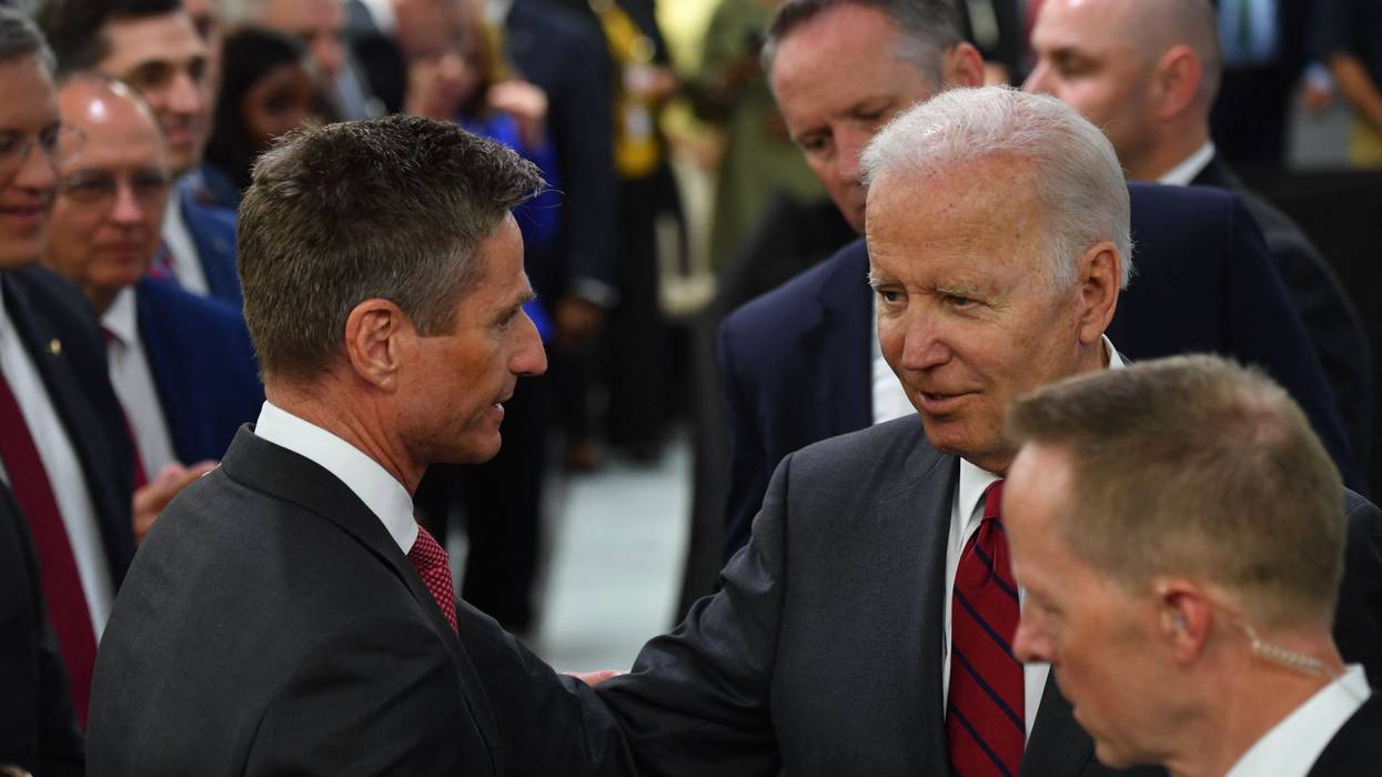 President Joe Biden talks with Lockheed Martin CEO Jim Taiclet