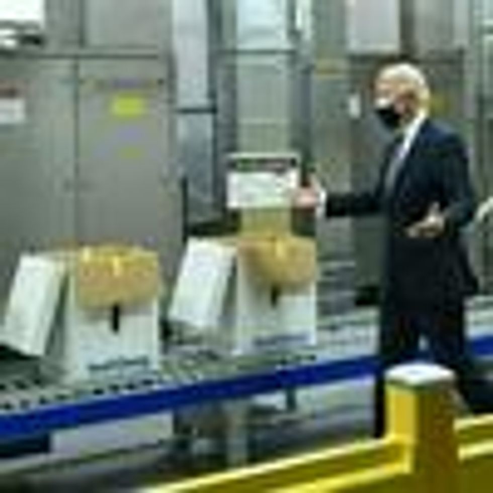 President Joe Biden tours a Pfizer facility