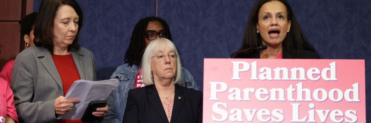 President of Planned Parenthood Alexis McGill Johnson speaks at a podium that says "Planned Parenthood Saves Lives."