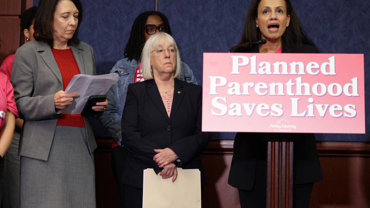 President of Planned Parenthood Alexis McGill Johnson speaks at a podium that says "Planned Parenthood Saves Lives."