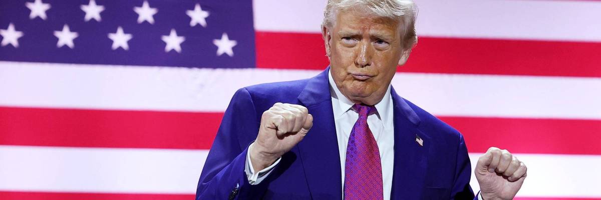 President Trump dances in front of a giant US flag