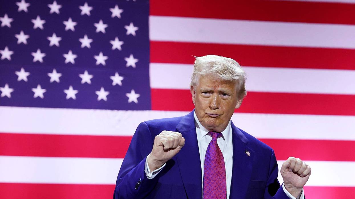 President Trump dances in front of a giant US flag