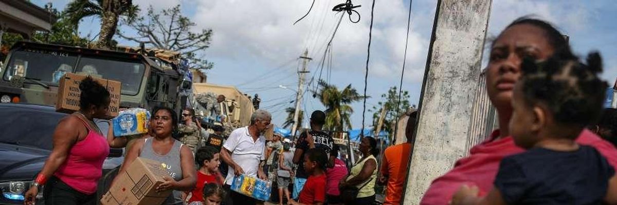 Storm Death Toll in Puerto Rico Rivals 9/11: But Where Is War on Climate Change?