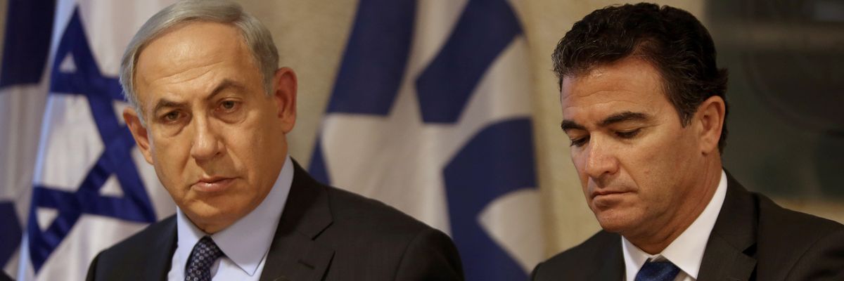 Prime Minister Benjamin Netanyahu (L) sitting next to Yossi Cohen