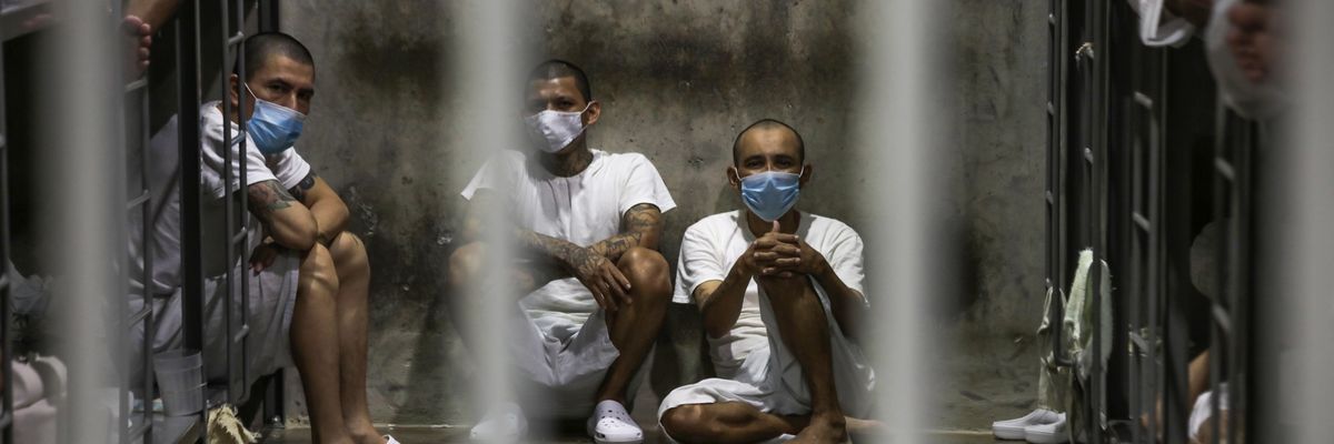 Prisoners look out of their cell at the maximum security penitentiary CECOT