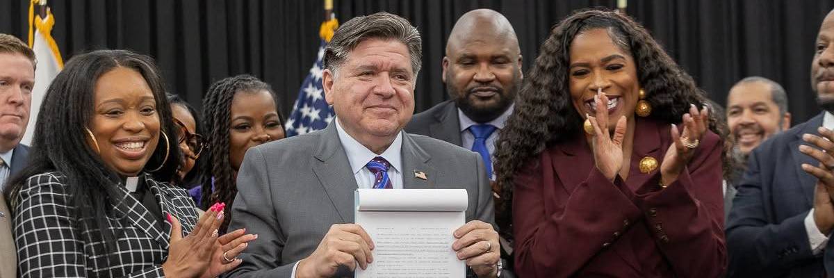 Pritzker and organizers pose with Clean Slate Act.